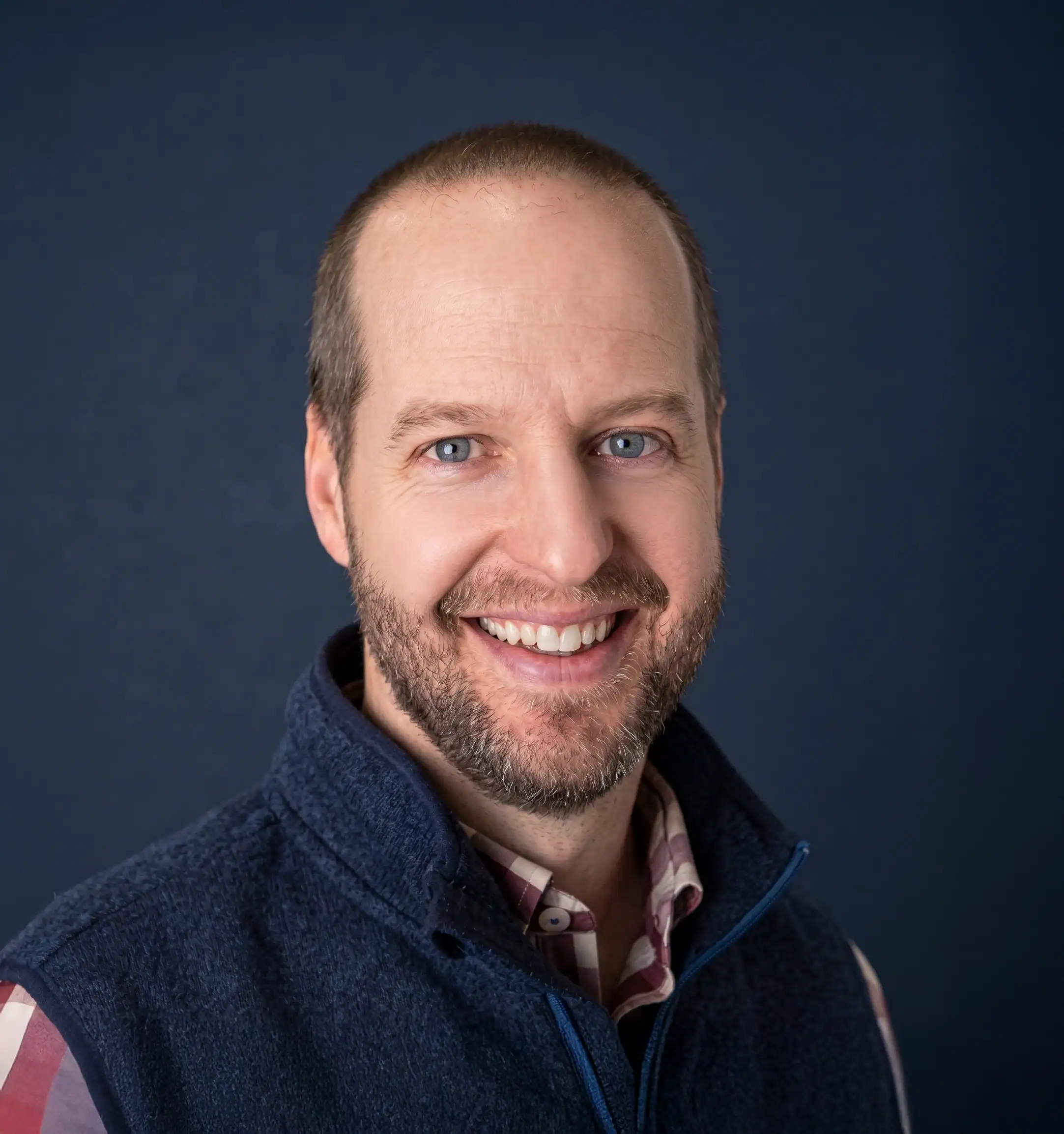 Portrait of a smiling man in professional attire for leadership image.