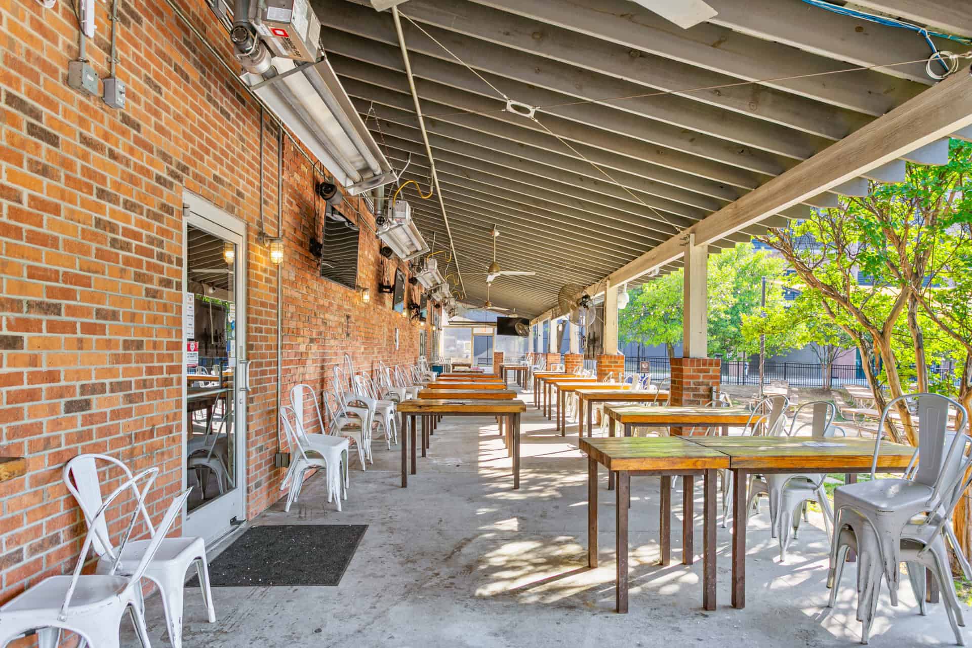 Outdoor patio with tables and chairs at Incline Construction Inc.