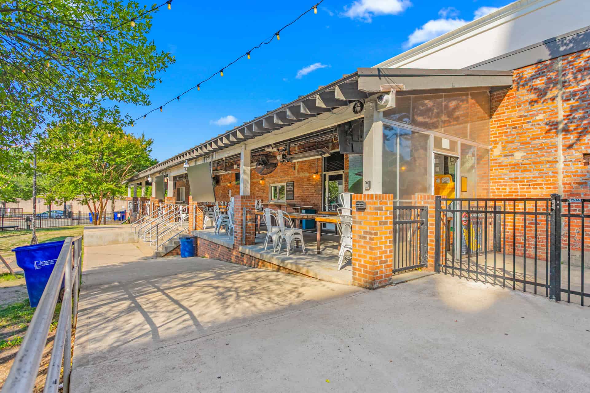 Outdoor patio of Incline Construction Inc with string lights and seating.